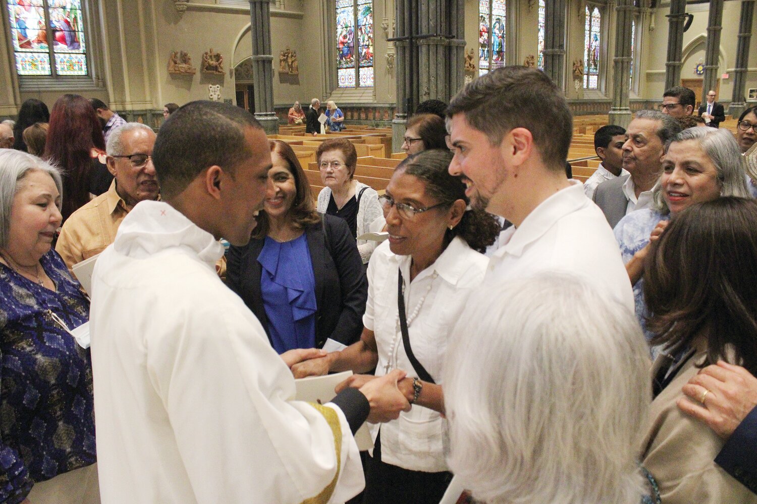 Deacon Olmos Rivera greets those who attended the Mass celebrating his ordination to the transitional diaconate.
